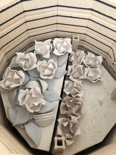 Colored paper porcelain flowers in kiln