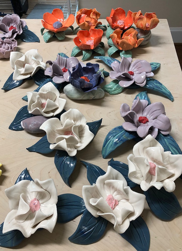 gluing leaves to porcelain flowers